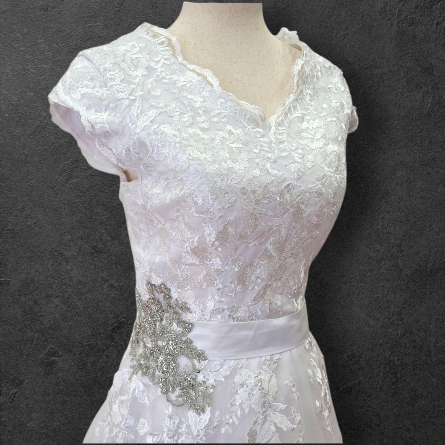 Cap Sleeve A Line Wedding Dress with Floral Appliques on Tulle Skirt with Silver Side Broach